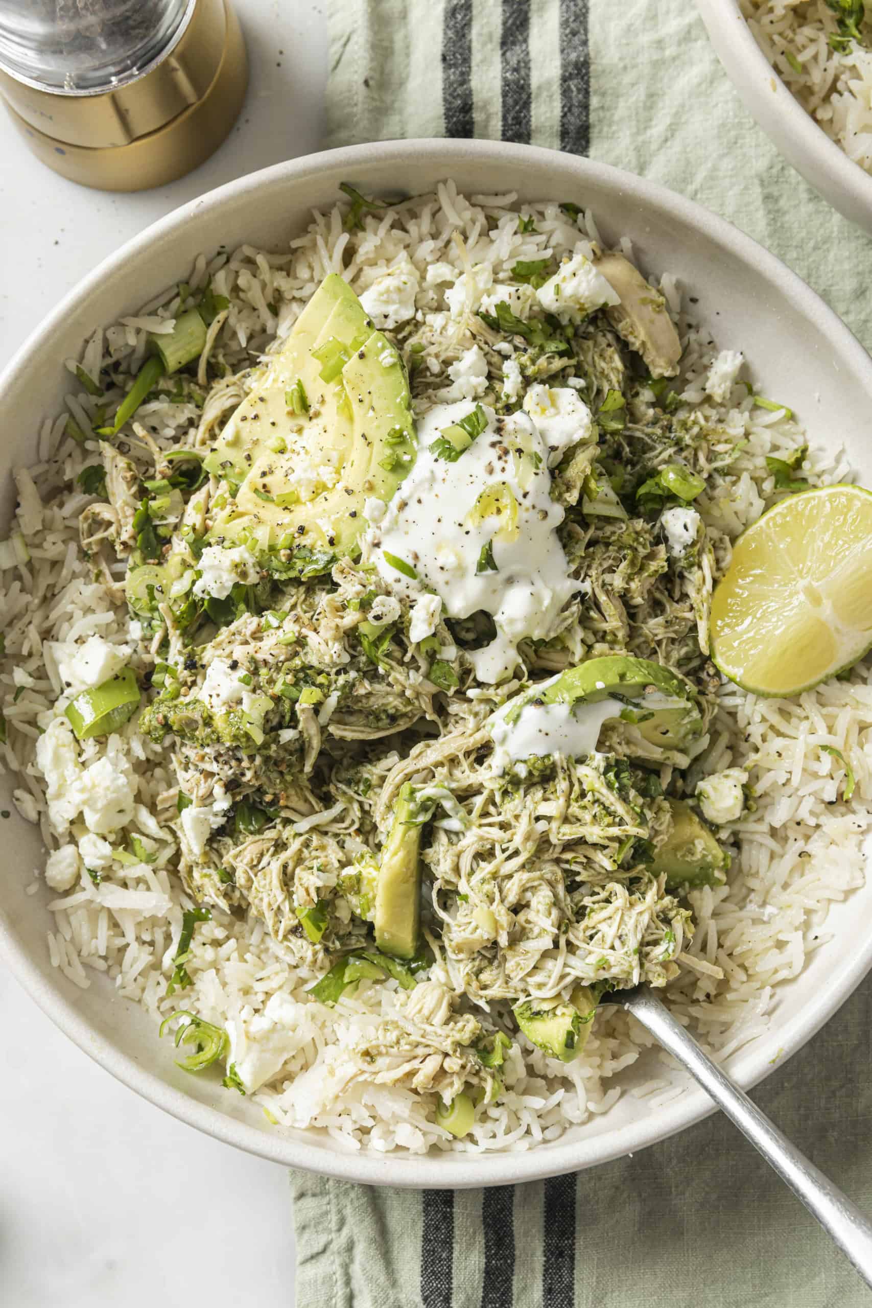 salsa verde chicken with toppings in a bowl