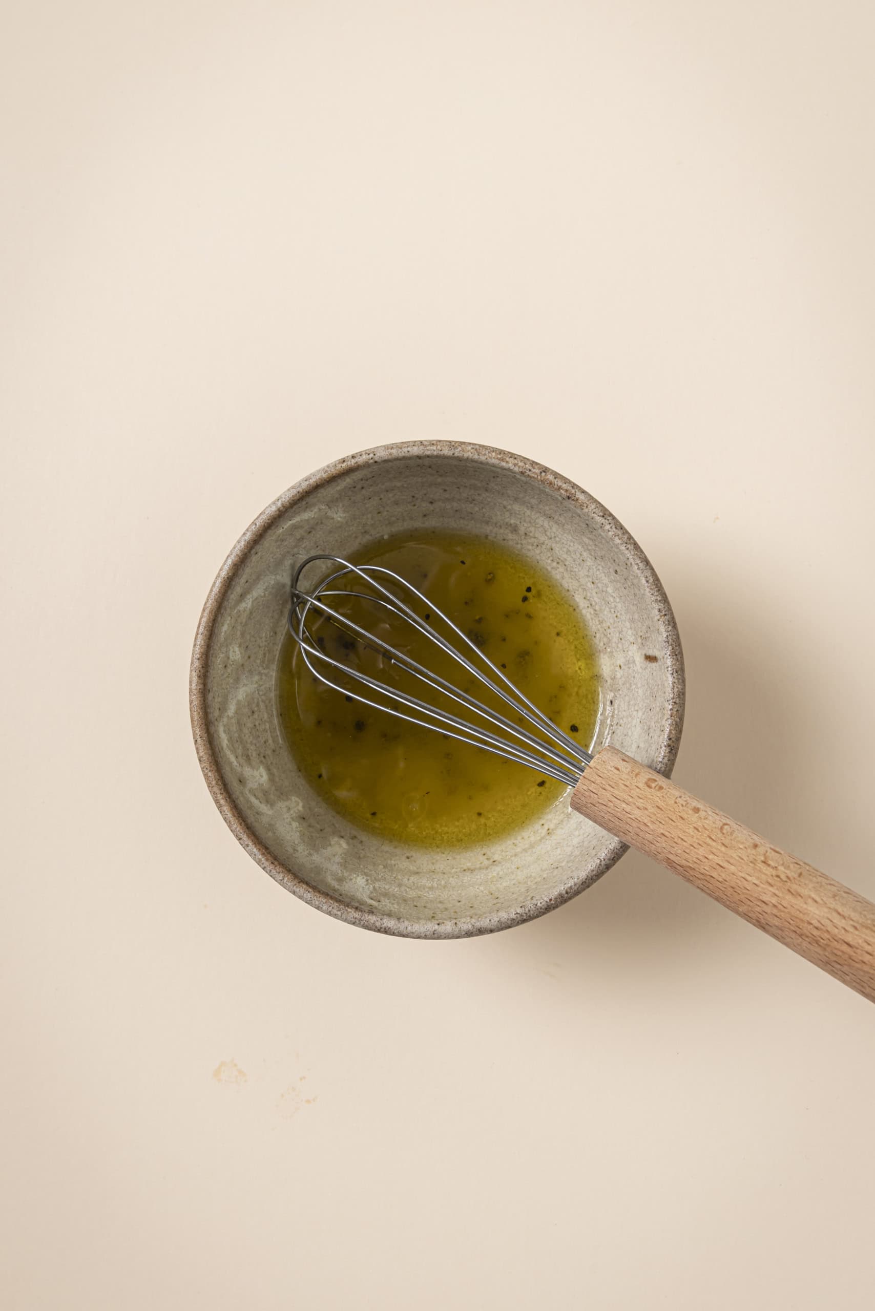 olive oil and vinegar dressing for pasta salad in a bowl
