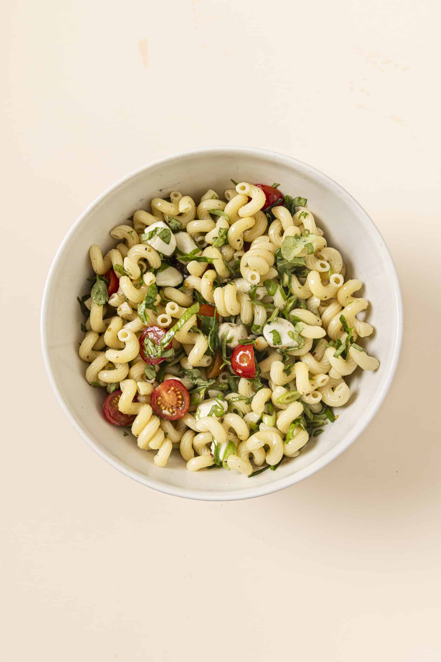 pasta, tomatoes and mozarella in a bowl