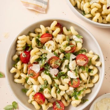 caprese pasta salad in a big white bowl
