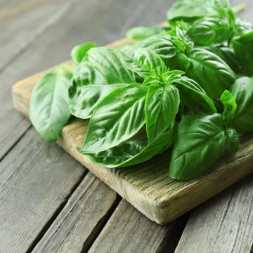 fresh basil on a cutting board