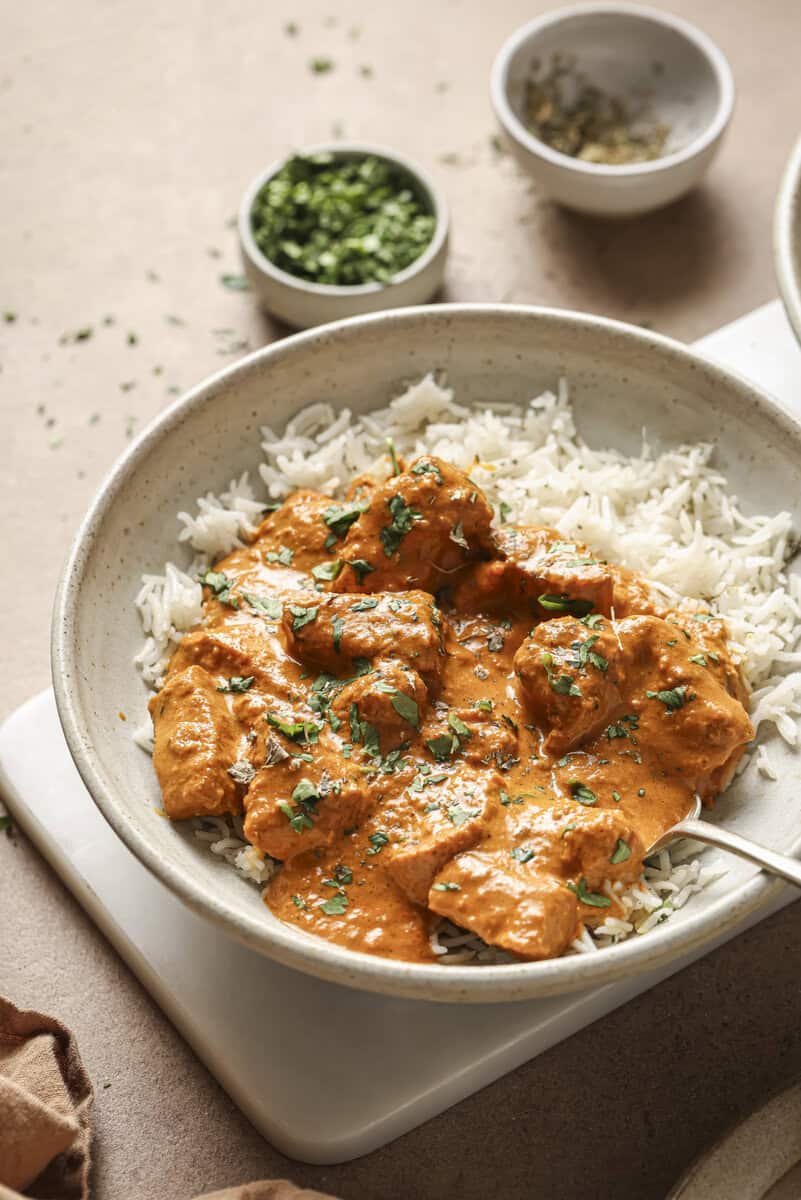 Chicken tikka masala in a bowl with rice.