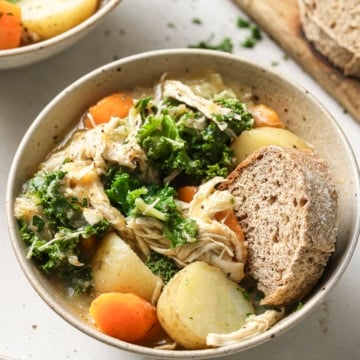 Chicken and vegetable soup in a bowl.