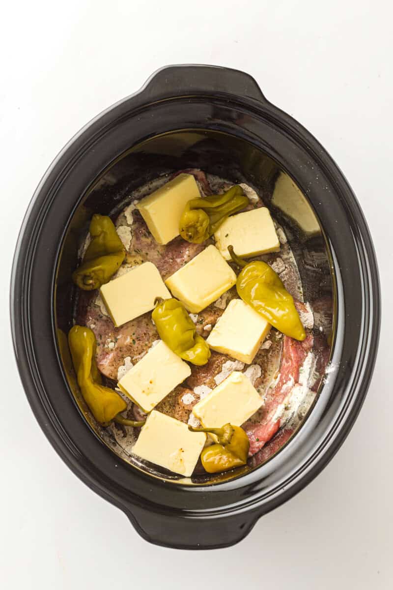 butter in crock pot with pork roast