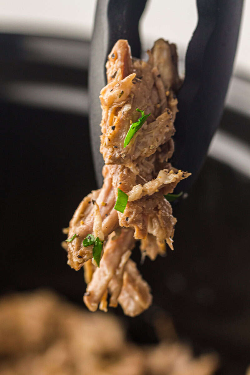 tong full of pork roast 