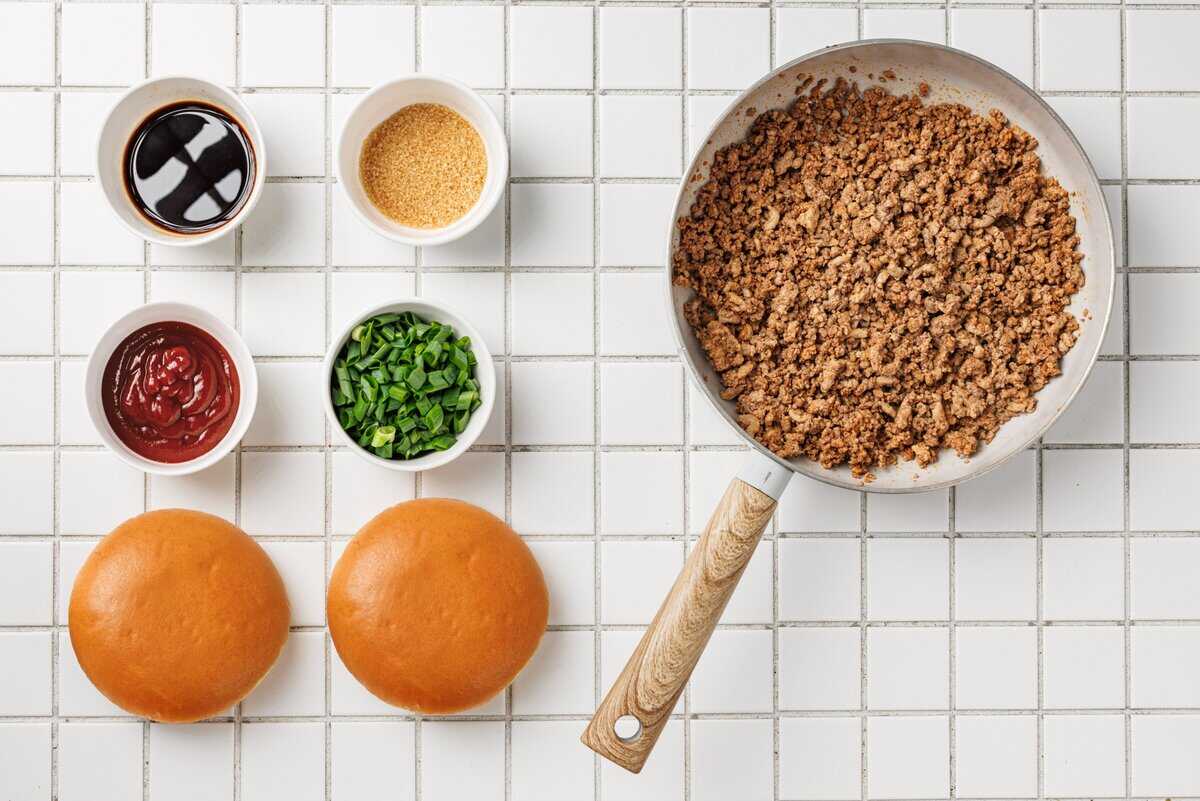 ground beef in pan with ingredients on the side