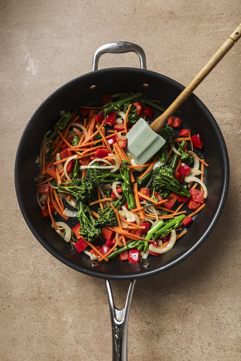 vegetables sauting in a skillet 