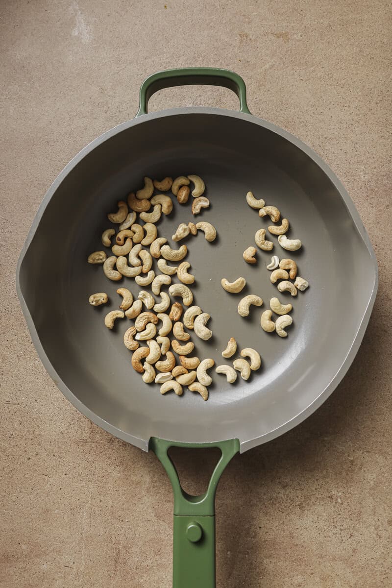 cashews toasting in skillet 