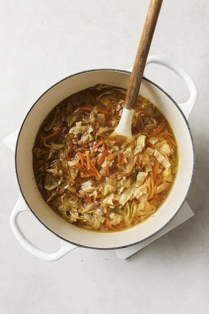 broth and vegetables in a dutch oven 