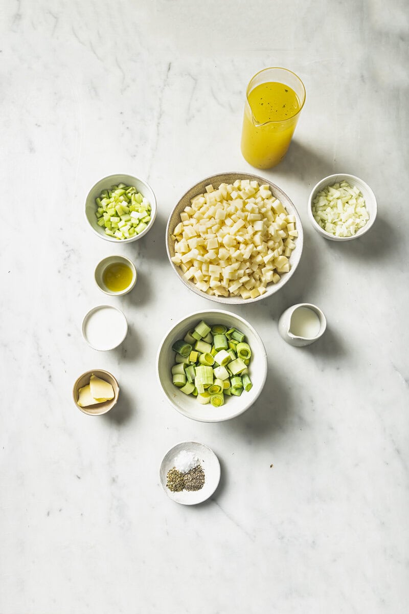 ingredients for potato soup in bowls