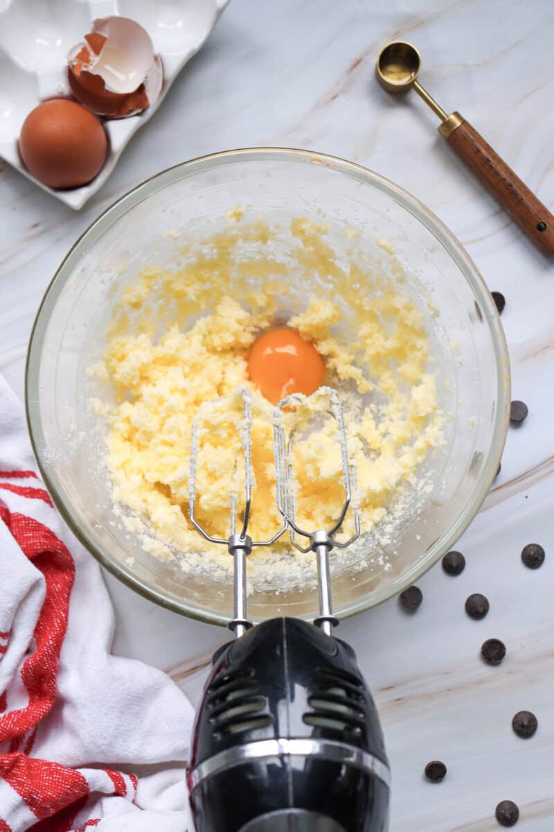 wet ingredients butter, sugar and eggs in a bowl
