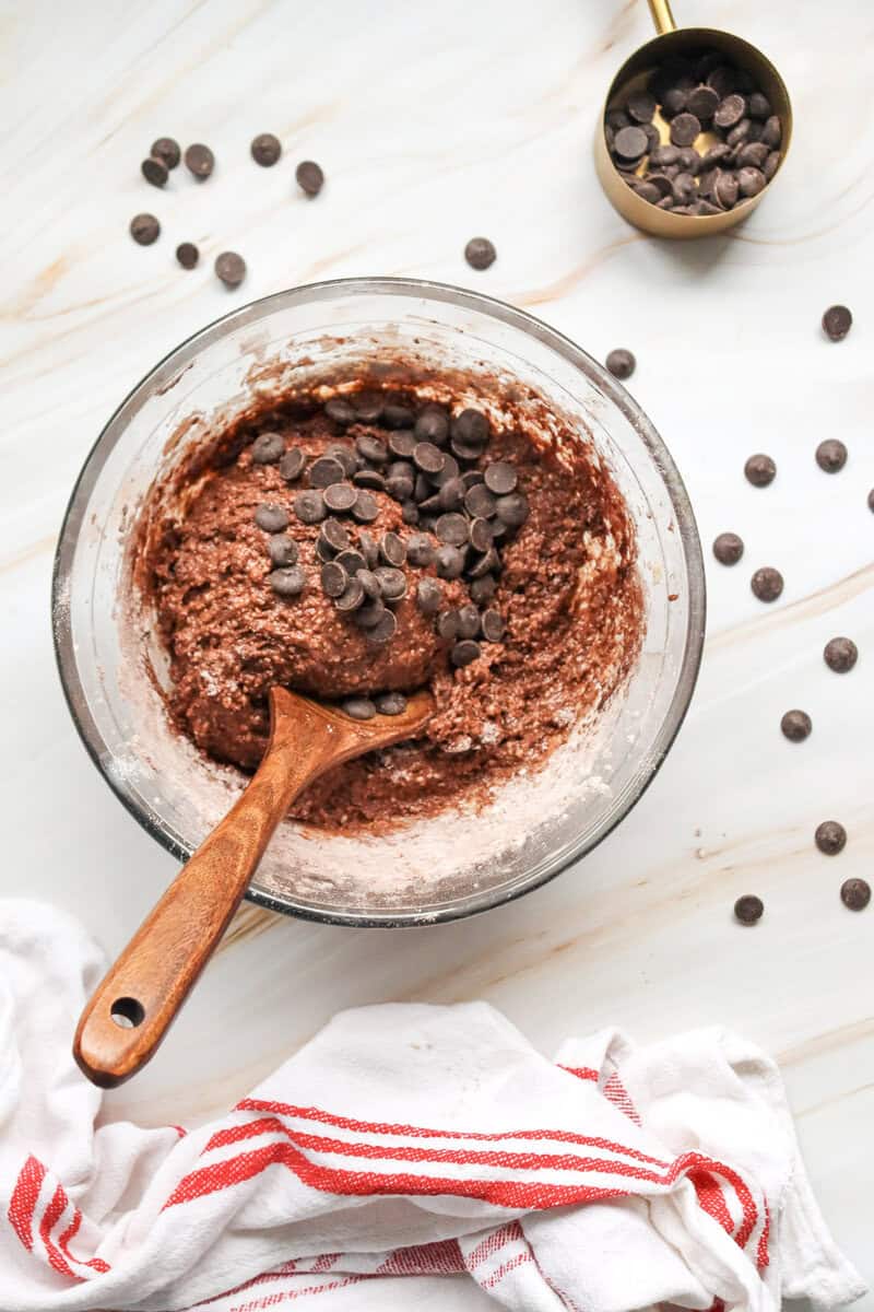 chocolate loaf cake batter in a bowl with chocolate chips