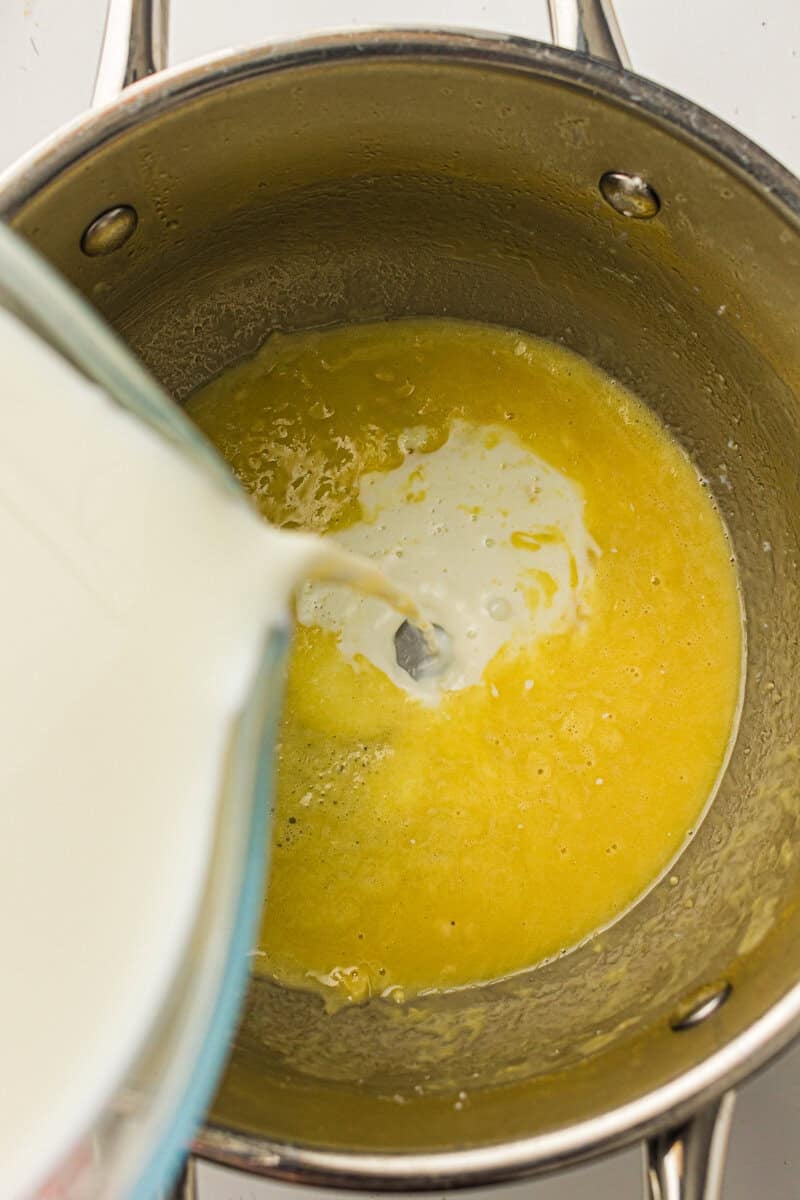 milk pouring into roux