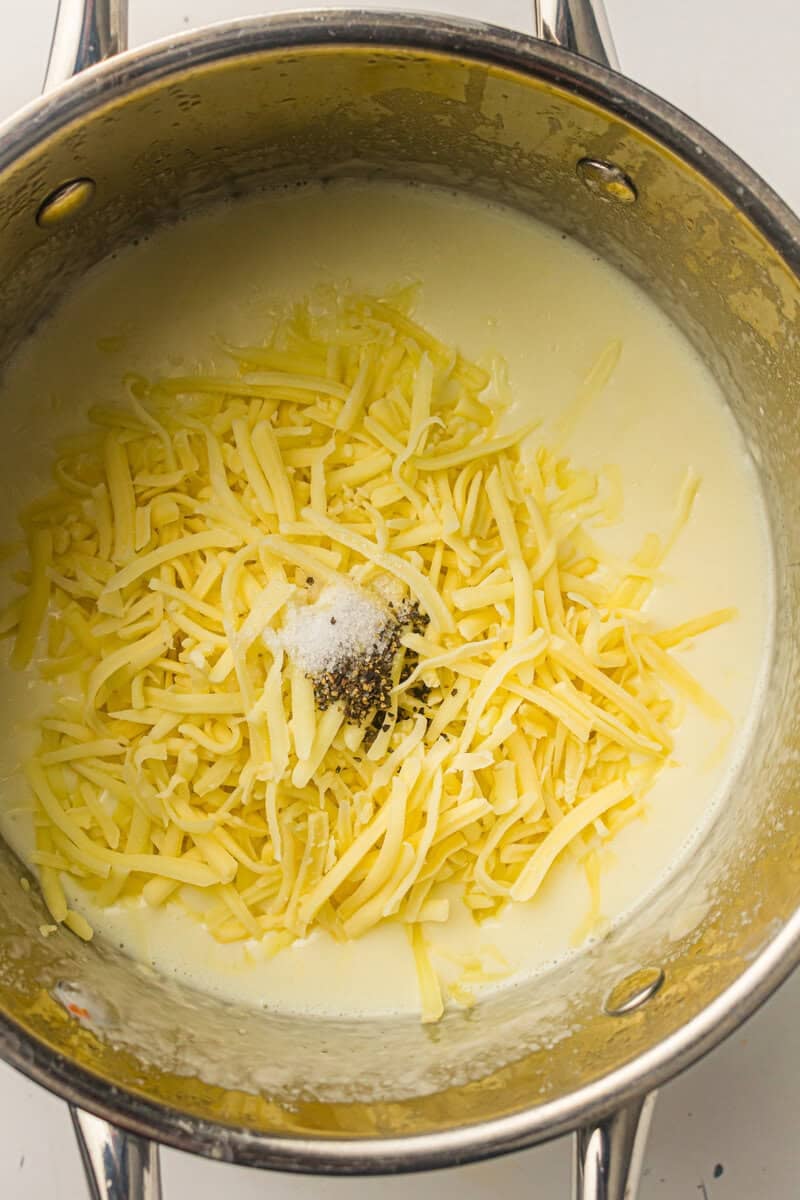 shredded cheese added to cheese sauce