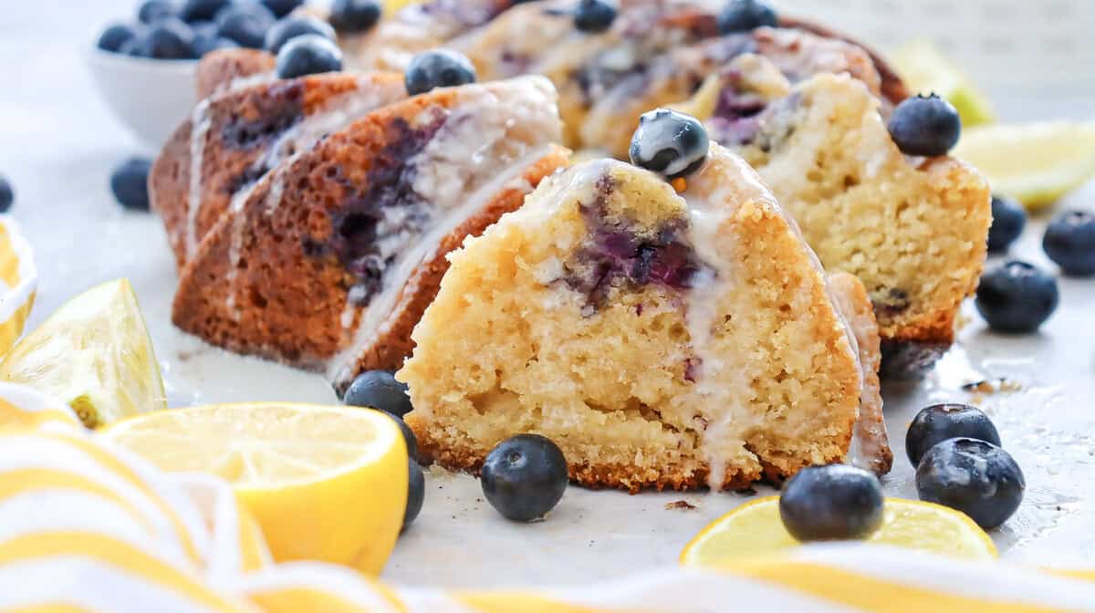 slice of lemon blueberry cake with frosting