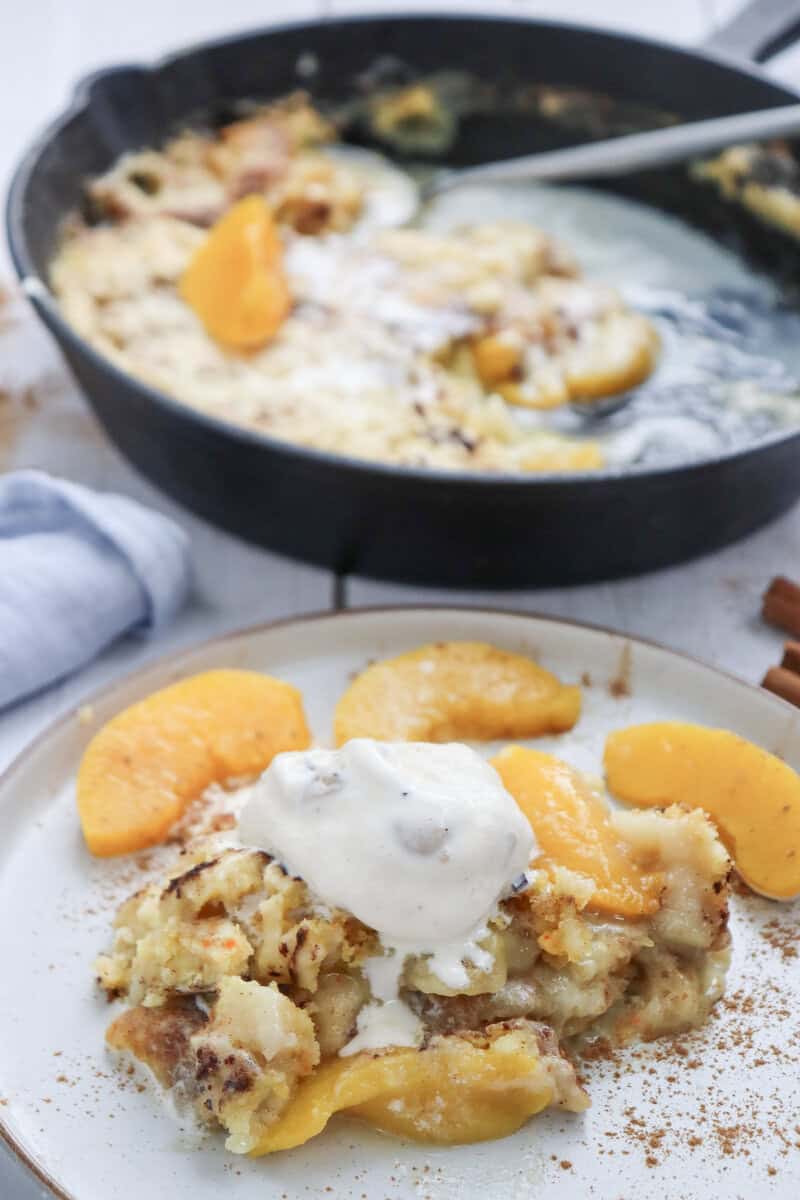dump cake on a plate with ice cream