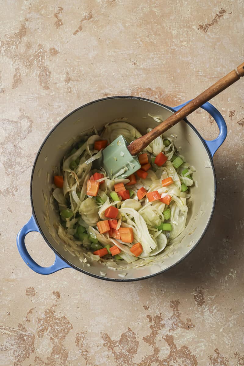 vegetables sauteing in dutch oven 