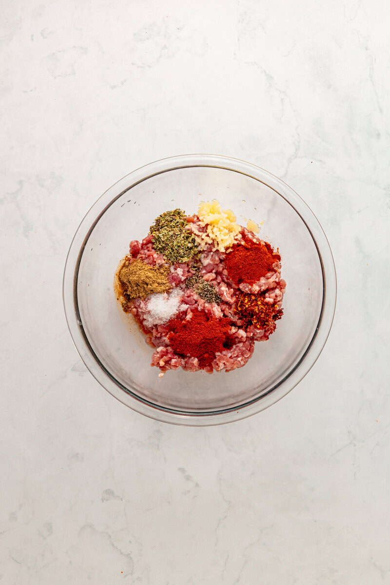 ground beef with spices in bowl