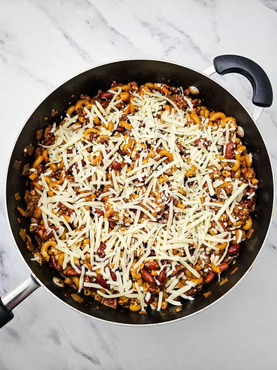 finished chili mac topped with cheese 