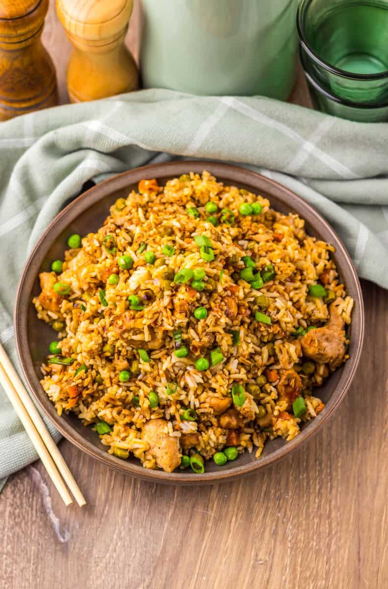 slow cooker chicken fried rice in a bowl with chopsticks
