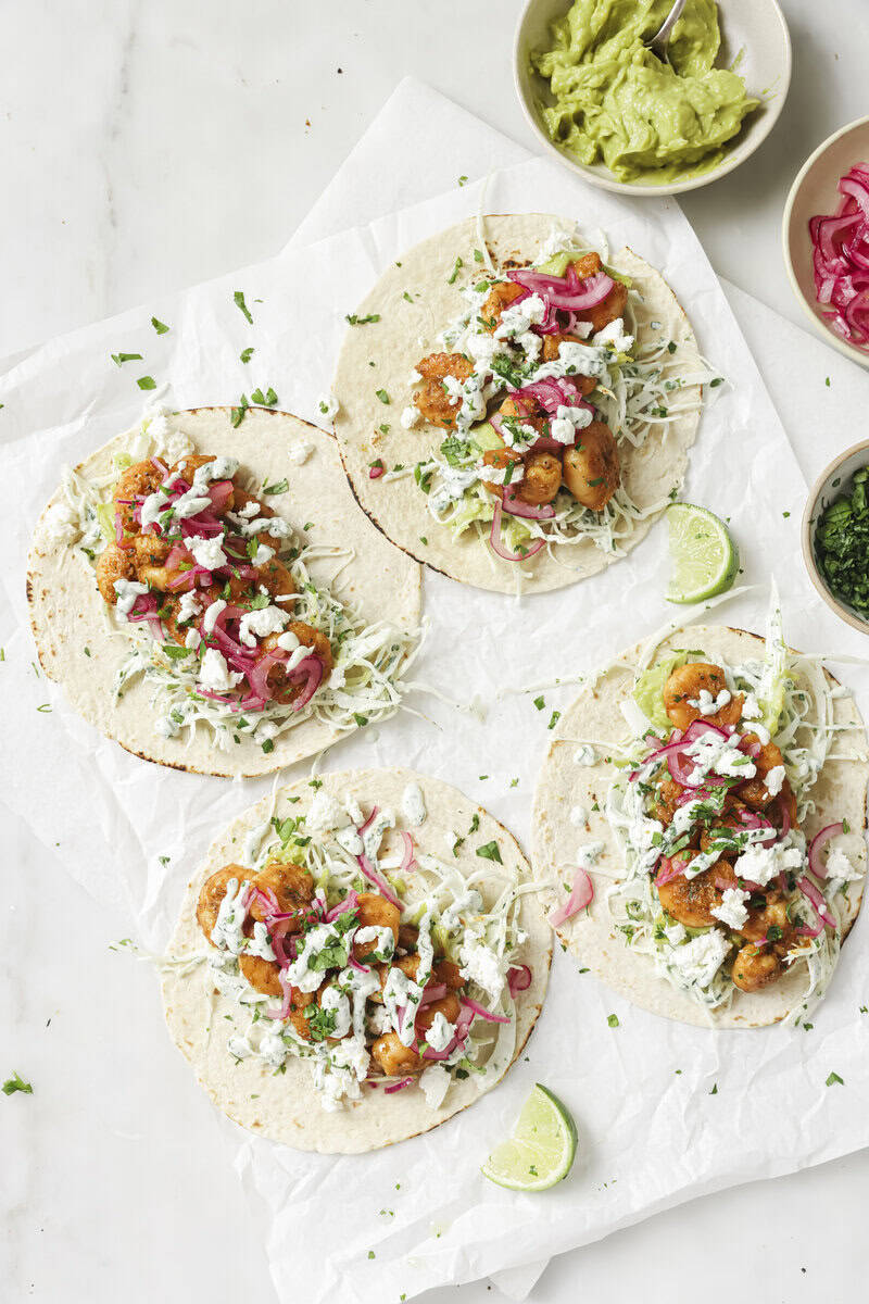 shrimp tacos on parchment paper