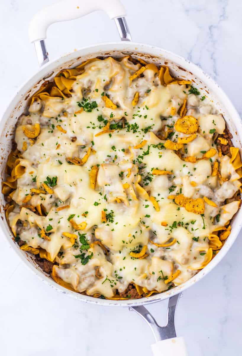 cheesy topping on beef noodle skillet