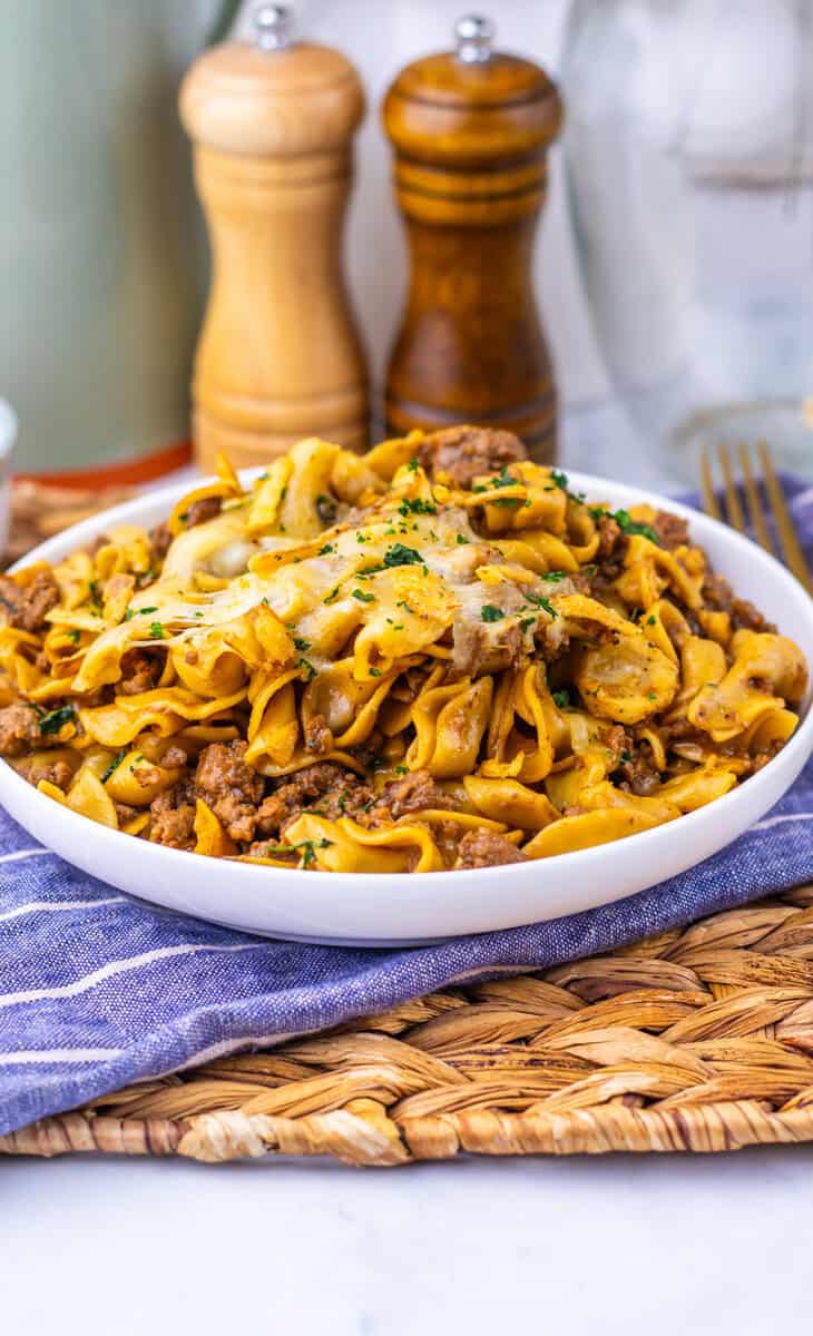 beef noodle skillet in a pan with cheese on top