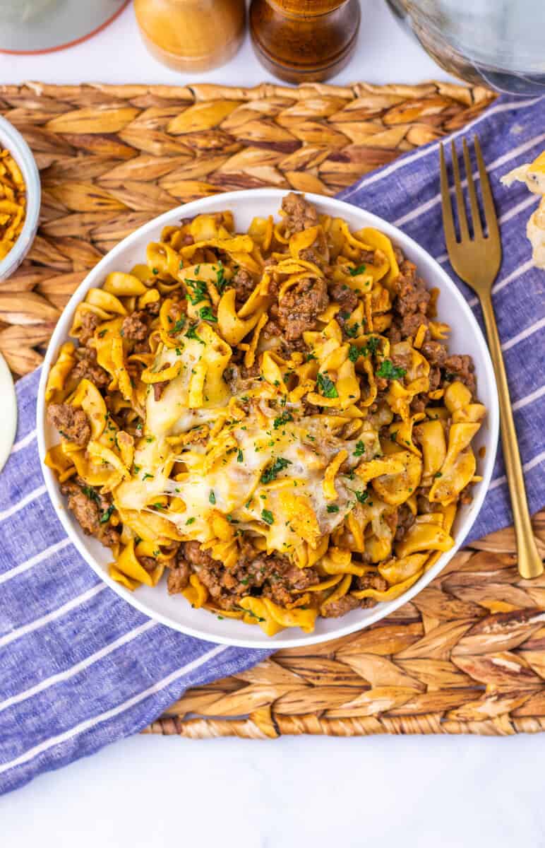 French Onion Beef Noodle Skillet Set on a plate topped with cheese