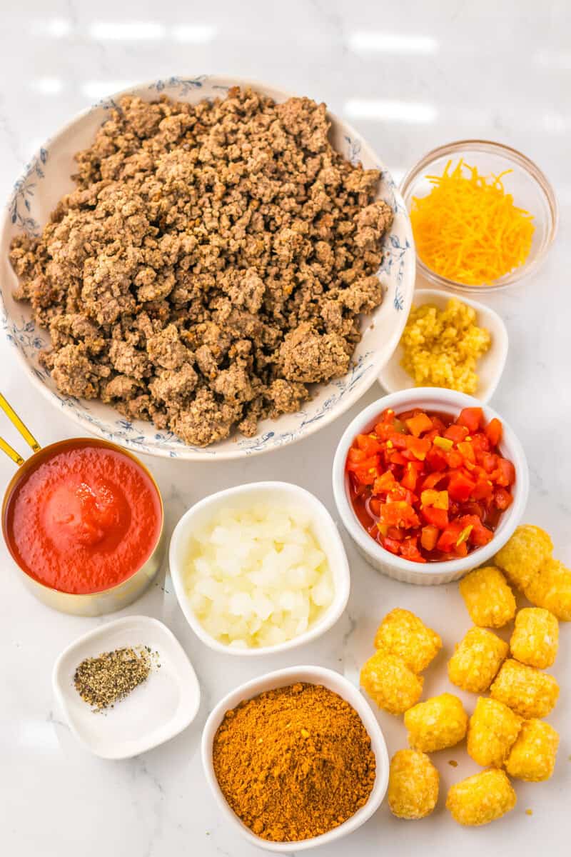 beef, tomatoes, tater tots for Slow Cooker Chili Cheese Tatertot Casserole 