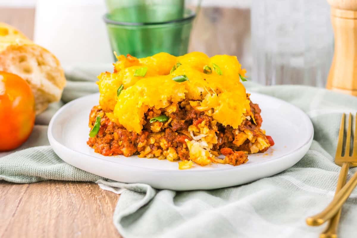 Slow Cooker Chili Cheese Tatertot Casserole  slice on a white plate