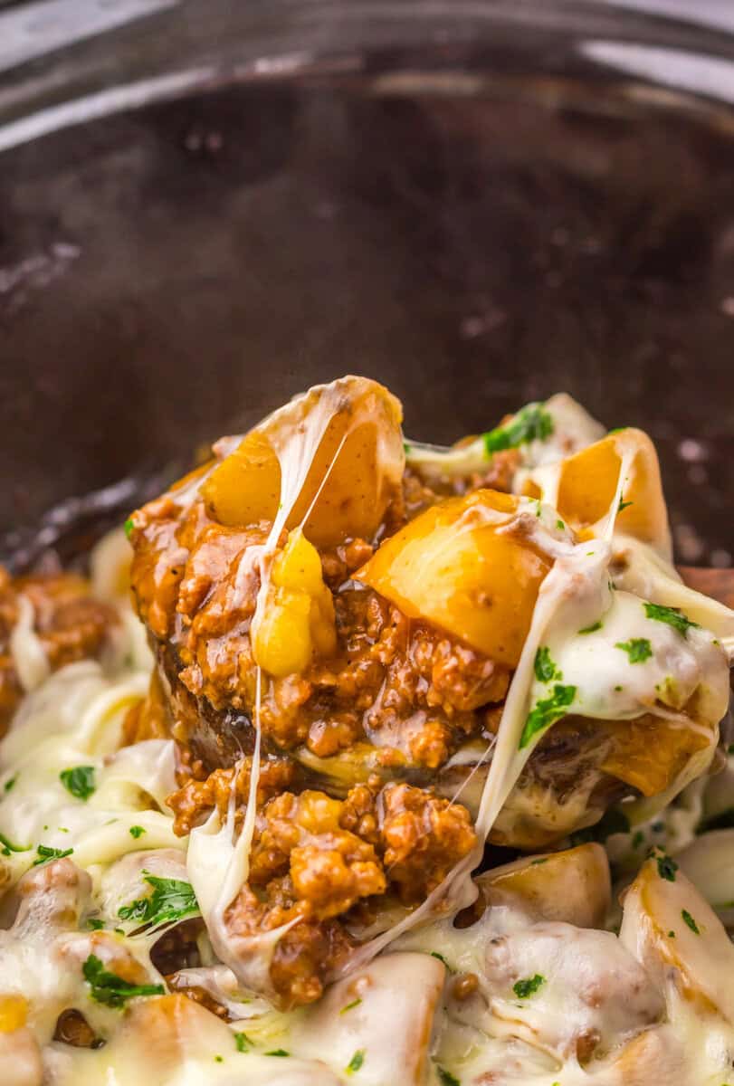 Slow Cooker French Onion Beef and Potatoes on a spoon