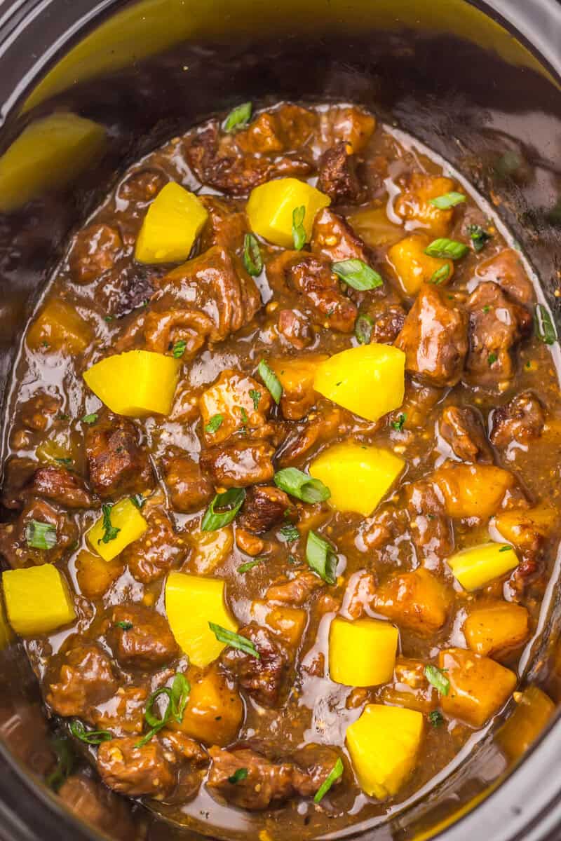 beef pineapple and sauce in a crockpot