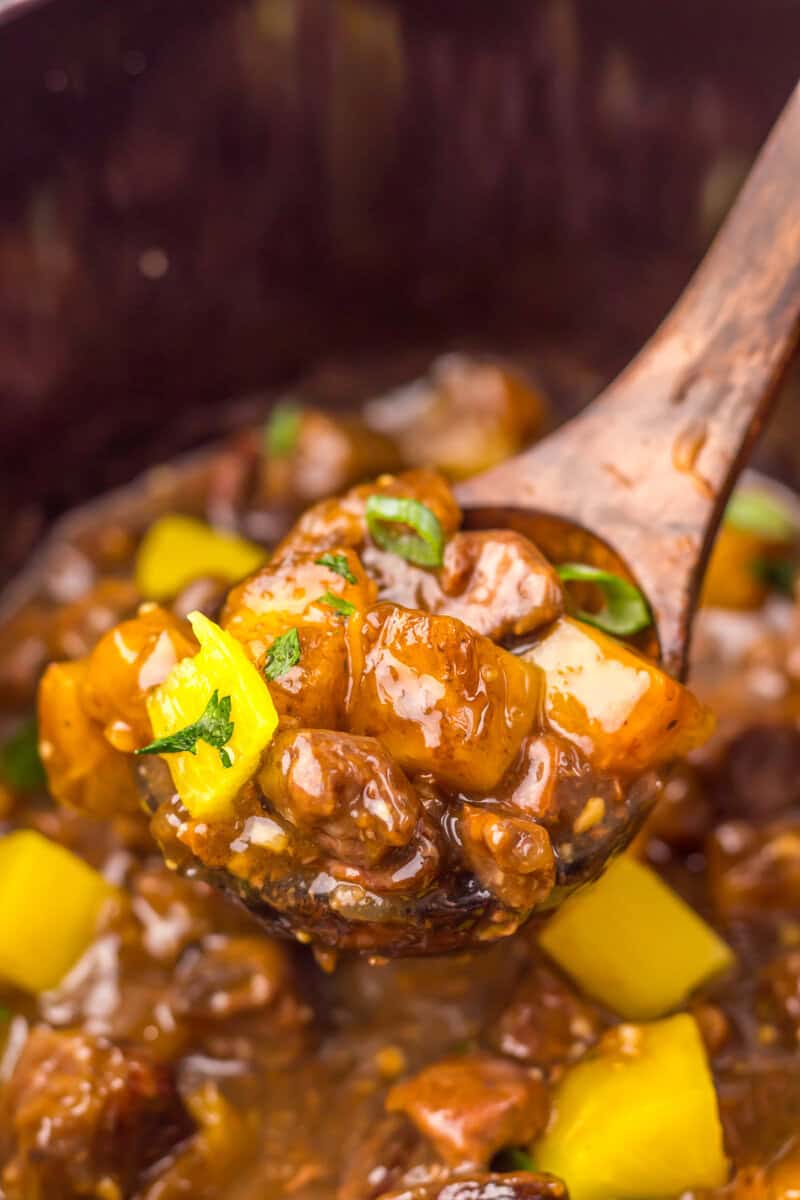 Slow Cooker Pineapple Teriyaki Steak Bites on a spoon