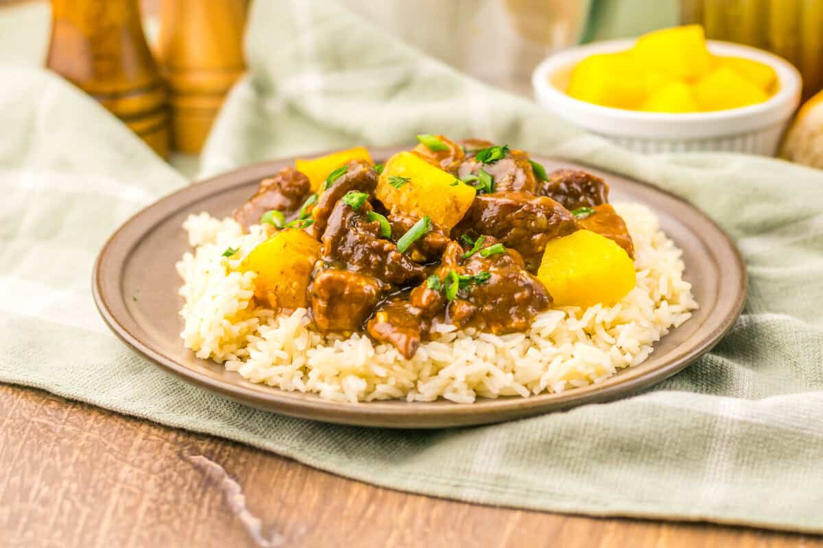 Slow Cooker Pineapple Teriyaki Steak Bites on a white plate