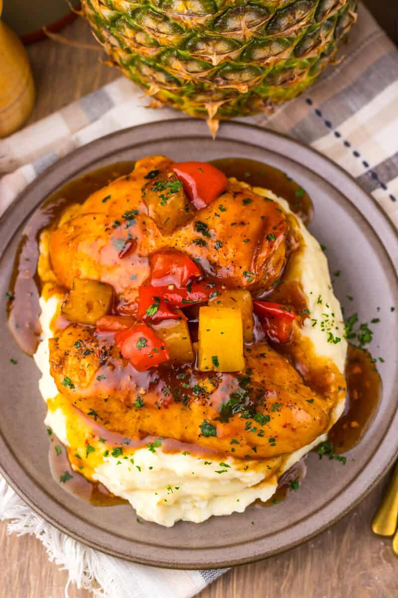 slow cooker sweet chili chicken on a plate with mashed potato