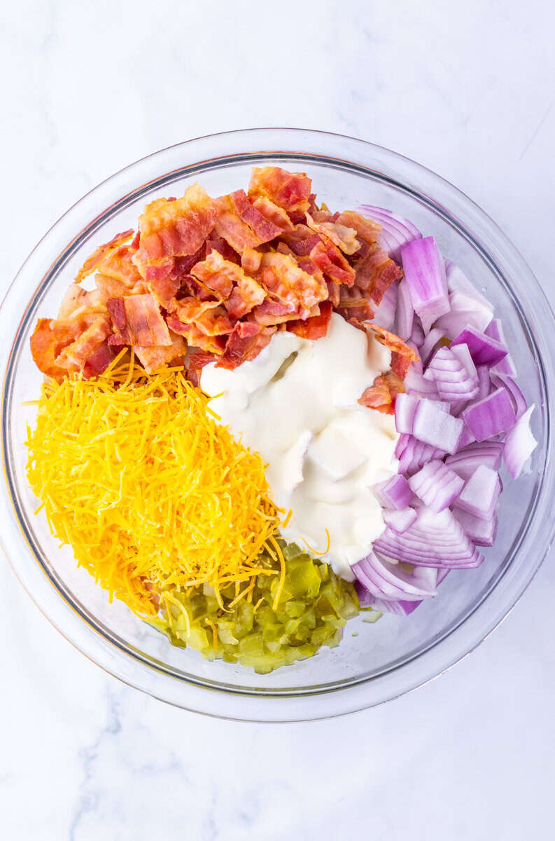 bacon, red onion, dressing, cheese and pickles for Steakhouse Potato Salad