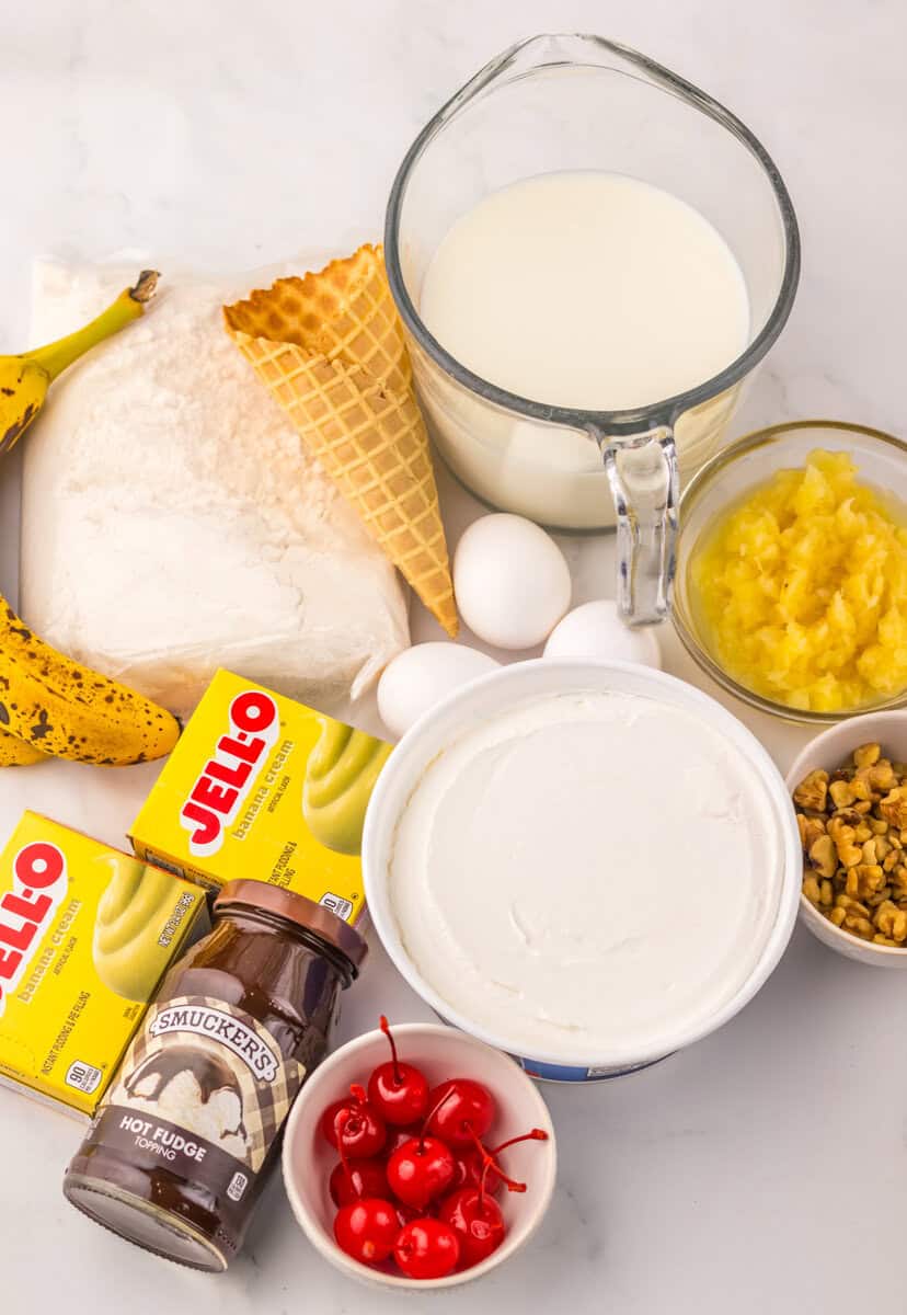 ingredients for banana split poke cake in bowls