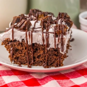 piece of choxolate poke cake on a plate