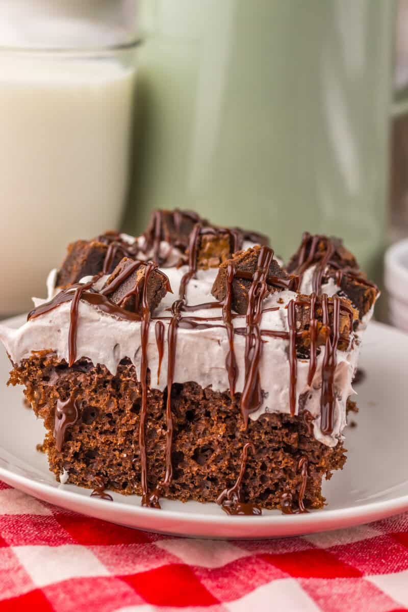 brownie batter poke cake with chocolate topping