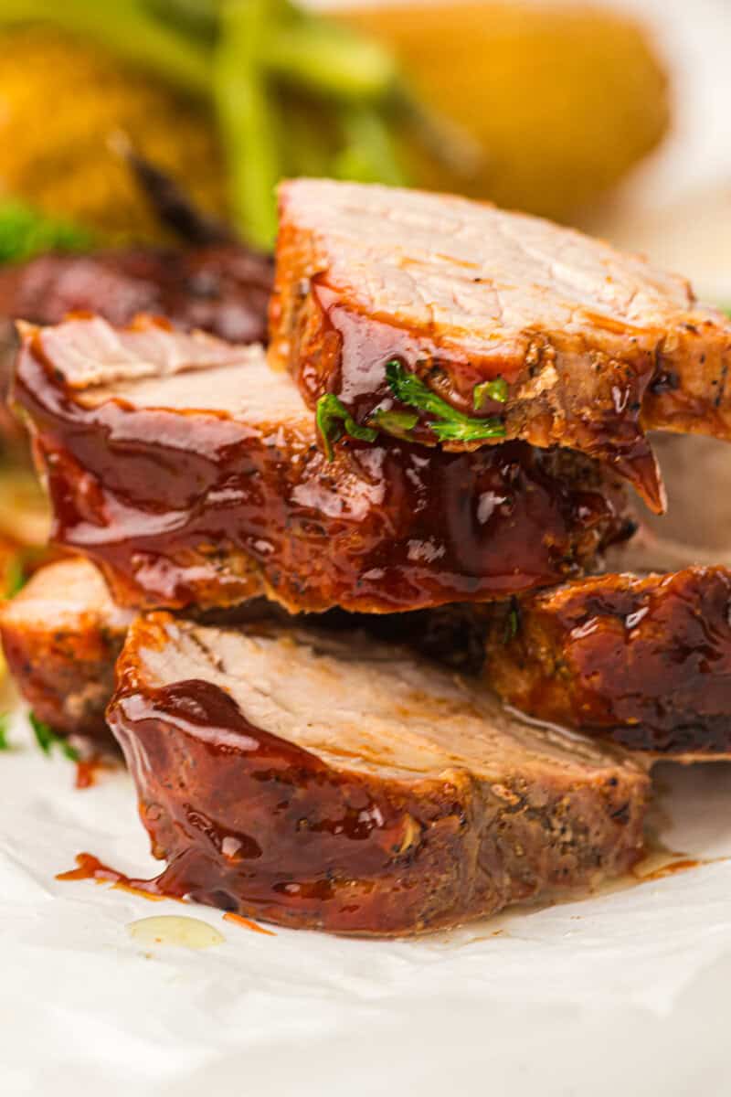 slices of grilled pork tenderloin with sauce