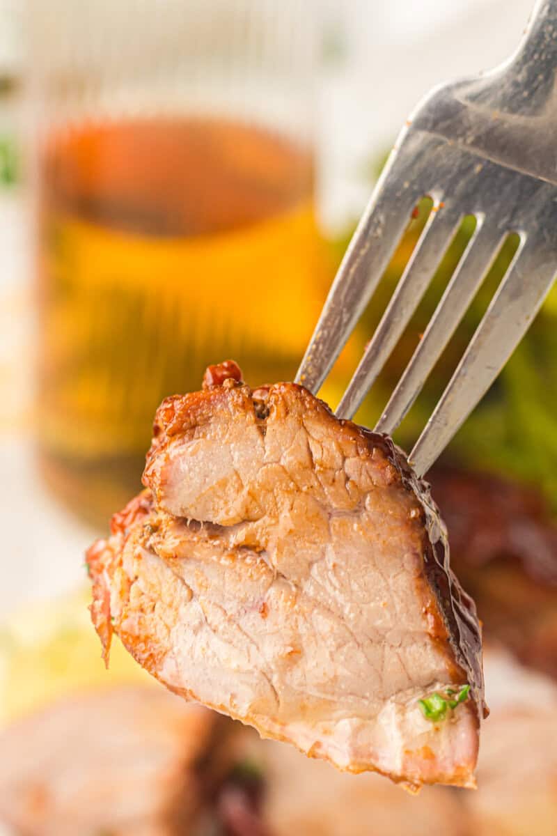 bite of grilled pork tenderloin