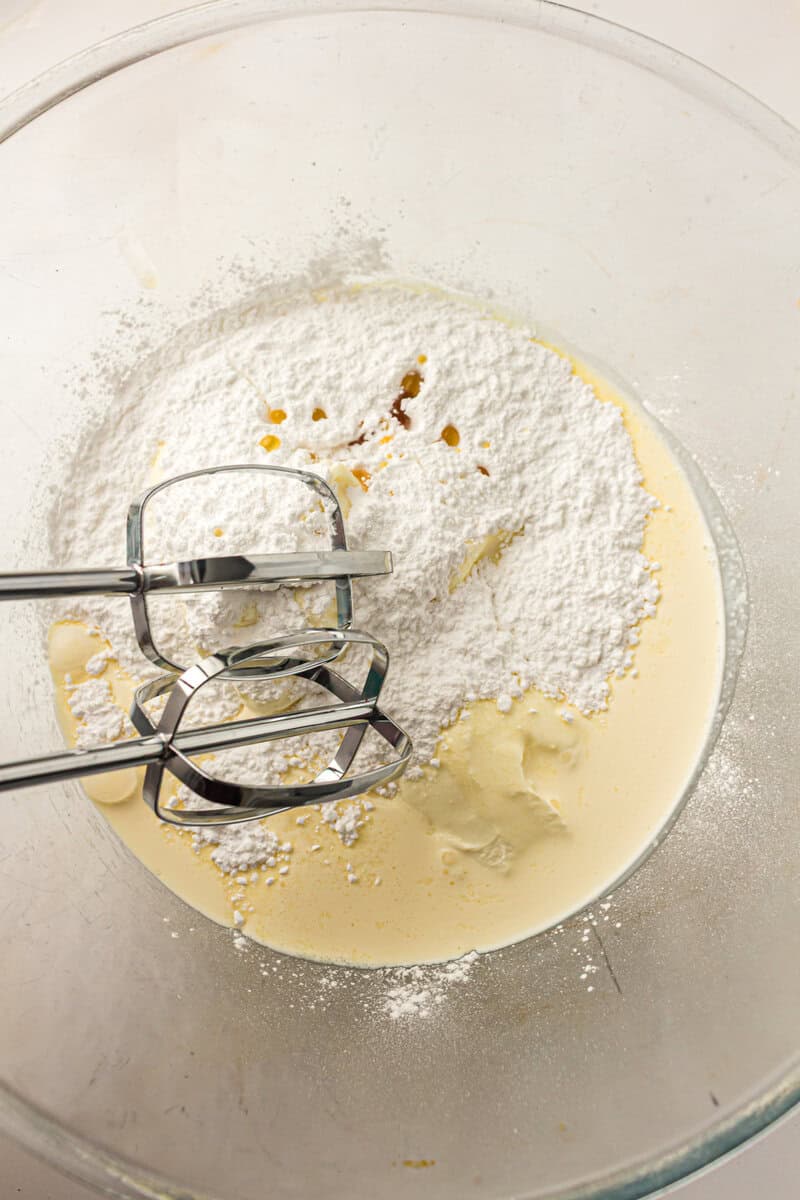 hand mixer in bowl with ingredients