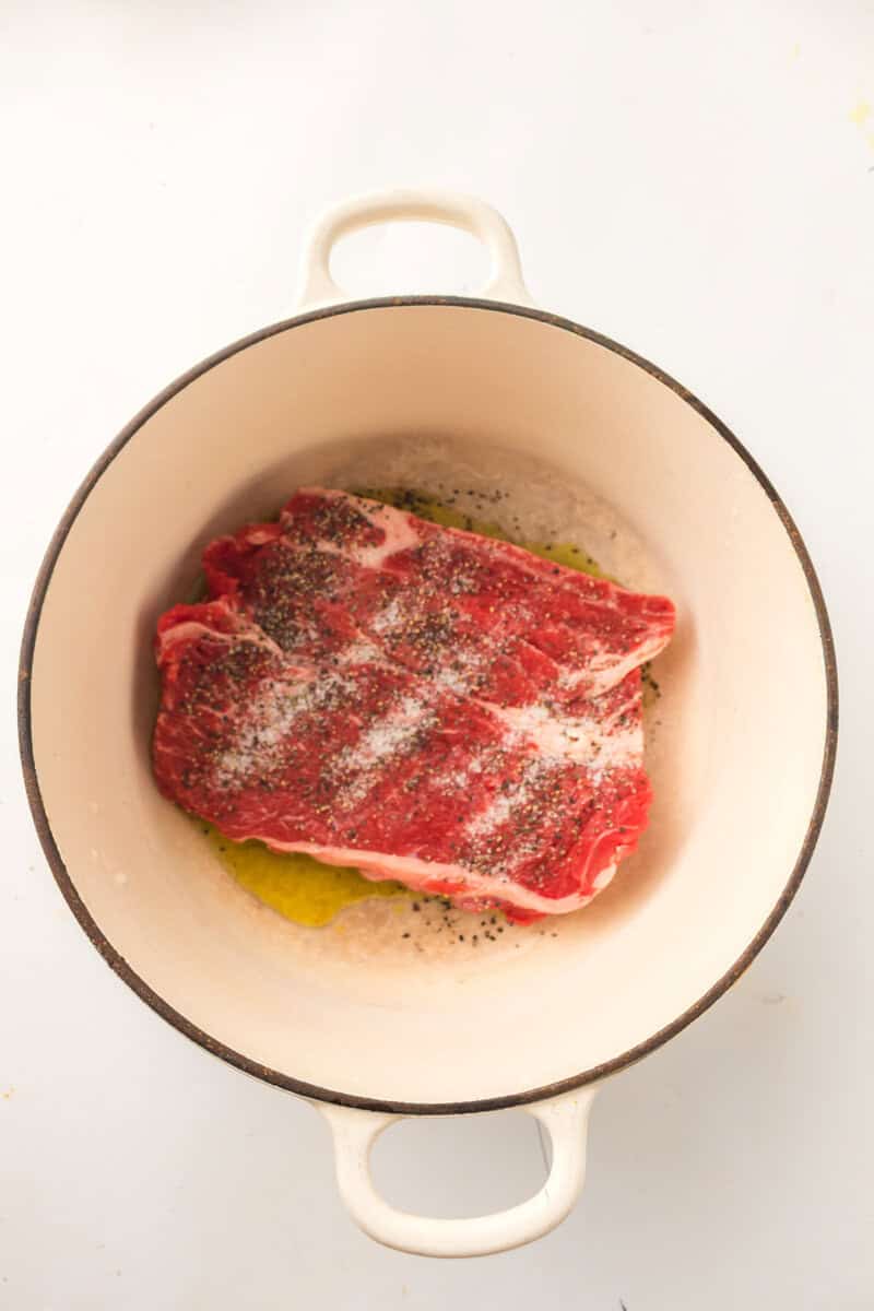 pot roast in dutch oven with salt and pepper