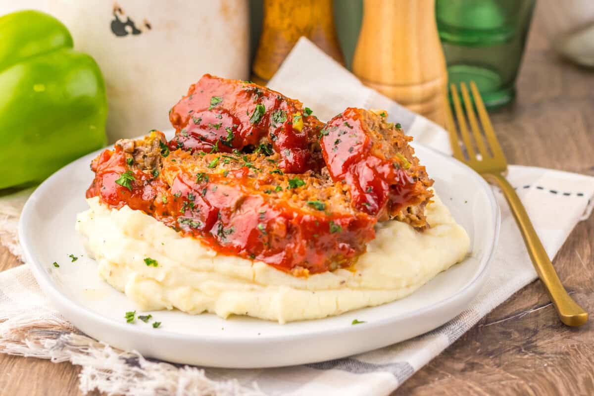 meatloaf on a plate with mashed potatoes