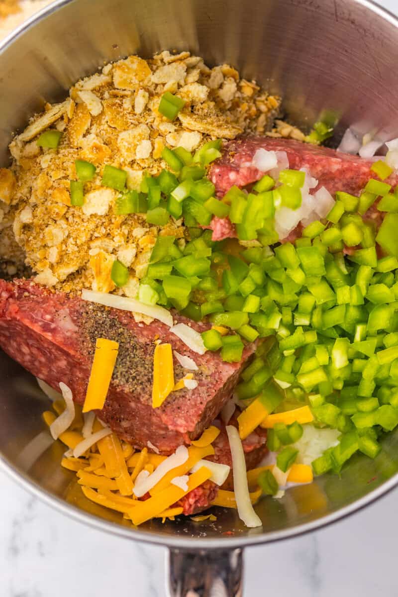 ground beef with onions and peppers in a bowl