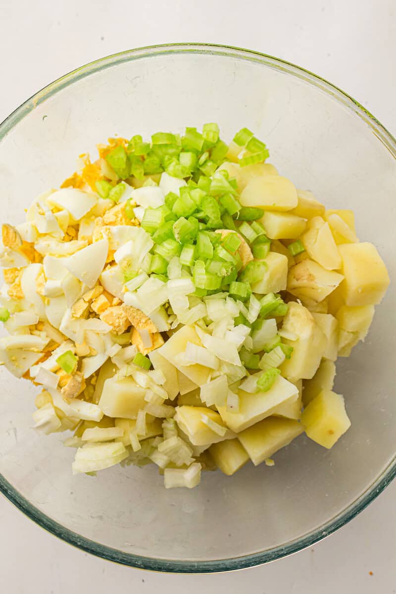 all ingredients for potato salad in a bowl