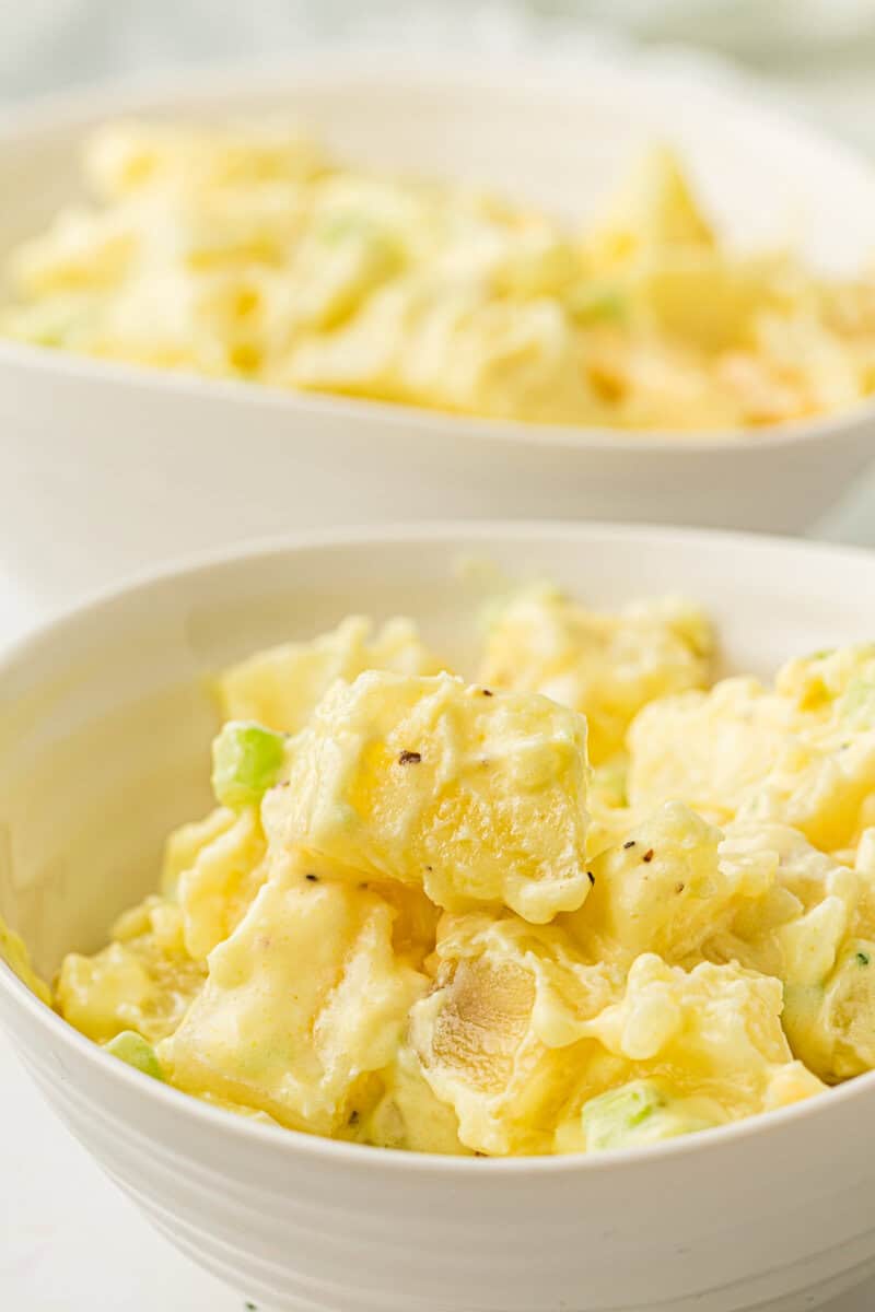 two servings of potato salad in bowls