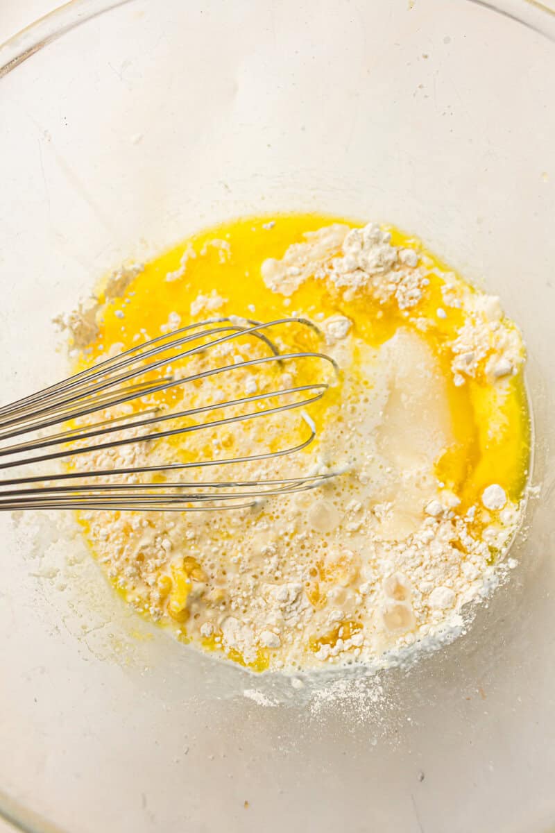 cobbler topping mixture in a bowl with a whisk