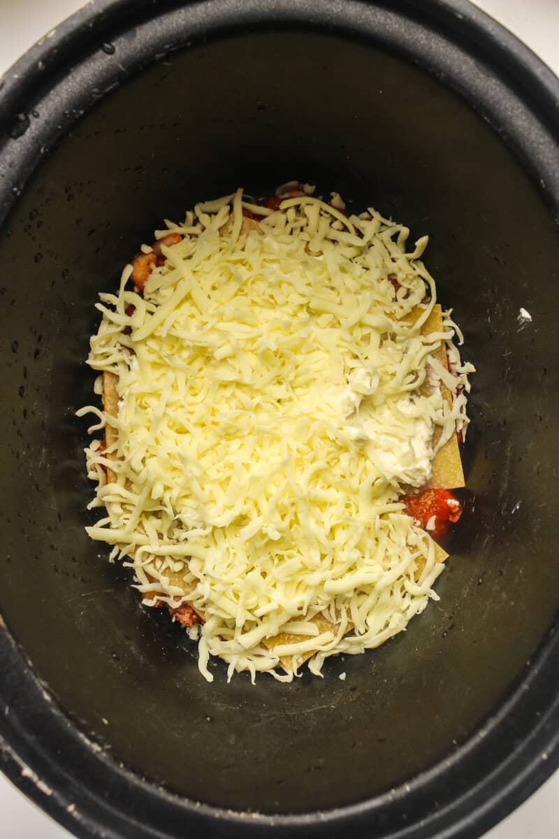 mozzarella cheese layer on top of meat sauce and pasta