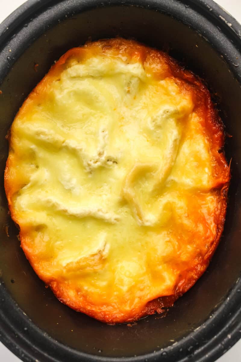 cooked slow cooker lasagna with gooey cheese